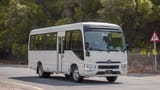 Used 2020 Toyota Coaster Bus White – Right Front Diagonal (45°) View at First Choice Cars Sharjah
