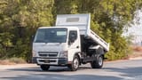 Used 2024 Mitsubishi Canter Tipper in White – Left Front Diagonal (45°) View for Sale at First Choice Cars Dubai Sharjah