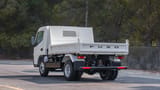 Used 2024 Mitsubishi Canter Tipper in White – Left Back Diagonal (45°) View for Sale at First Choice Cars Dubai Sharjah