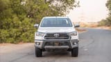 Used 2024 Toyota Hilux DLX Double Cabin in White – Front View for Sale at First Choice Cars Dubai Sharjah