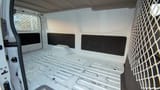 Used 2022 Nissan Urvan Standard Roof White – Delivery Box Right Side Interior View at First Choice Cars Sharjah