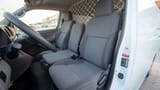 Used 2022 Nissan Urvan Standard Roof White – Front Driver Side Cabin View at First Choice Cars Sharjah
