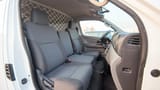 Used 2022 Nissan Urvan Standard Roof White – Front Passenger Side Cabin View at First Choice Cars Sharjah