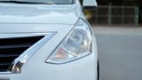 Used 2022 Nissan Sunny SV in White – Headlight Close-up for Sale at First Choice Cars Dubai Sharjah