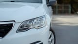 Used 2021 Peugeot 301 Allure in White – Headlight Close-up for Sale at First Choice Cars Dubai Sharjah