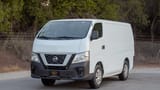 Used 2021 Nissan Urvan Standard Roof White – Left Front Diagonal (45°) View at First Choice Cars Sharjah