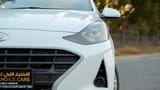 Used 2023 Hyundai Grand i10 Smart White – Headlight Close-up at First Choice Cars Sharjah