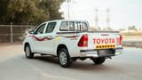 Used 2022 Toyota Hilux GLX Double Cabin White – Left Back Diagonal (45°) View at First Choice Cars Sharjah