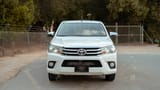 Used 2022 Toyota Hilux GLX Double Cabin White – Front View at First Choice Cars Sharjah