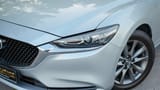 Used 2023 Mazda 6 S Grade Silver – Headlight Close-up at First Choice Cars Sharjah