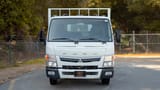 Used 2022 Mitsubishi Canter Cargo Body in White – Front View for Sale at First Choice Cars Dubai Sharjah