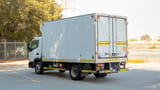 Used 2020 Mitsubishi Canter Chiller Box White – Left Back Diagonal (45°) View at First Choice Cars Sharjah