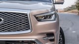 Used 2023 Infiniti QX80 Luxury Gold – Headlight Close-up at First Choice Cars Sharjah