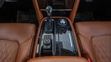 Used 2023 Infiniti QX80 Luxury Gold – Center Console & Gear Shifter at First Choice Cars Sharjah