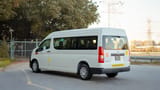 Used 2021 Toyota Hiace GL High Roof White – Left Back Diagonal (45°) View at First Choice Cars Sharjah