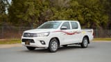 Used 2021 Toyota Hilux GLX Double Cabin White – Left Front Diagonal (45°) View at First Choice Cars Sharjah