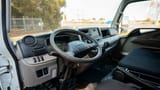 Used 2023 Mitsubishi Canter Cargo Body White – Driver Side Dashboard & Steering View at First Choice Cars Sharjah