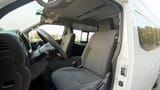 Used 2024 Nissan Urvan High Roof White – Front Driver Side Cabin View at First Choice Cars Sharjah