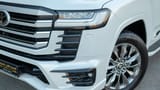 Used 2025 Toyota Land Cruiser VXR White – Headlight Close-up at First Choice Cars Sharjah