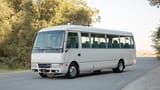 Used 2022 Mitsubishi ROSA Passenger Bus in White – Left Front Diagonal (45°) View for Sale at First Choice Cars Dubai Sharjah