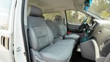 Used 2021 Hyundai H1 12-Seater Wagon in White – Front Passenger Side Cabin View for Sale at First Choice Cars Dubai Sharjah