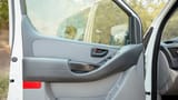 Used 2021 Hyundai H1 12-Seater Wagon in White – Driver Door Panel Full View for Sale at First Choice Cars Dubai Sharjah