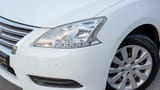 Used 2019 Nissan Sentra S in White – Headlight Close-up for Sale at First Choice Cars Dubai Sharjah