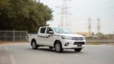 Used 2024 Toyota Hilux GL Double Cabin in White – Right Front Diagonal (45°) View for Sale at First Choice Cars Dubai Sharjah