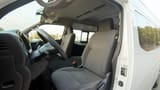 Used 2023 Nissan Urvan High Roof in White – Front Driver Side Cabin View for Sale at First Choice Cars Dubai Sharjah