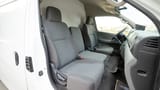 Used 2022 Nissan Urvan High Roof in White – Front Passenger Side Cabin View for Sale at First Choice Cars Dubai Sharjah