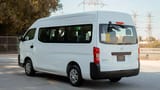 Used 2019 Nissan Urvan High Roof in White – Left Back Diagonal (45°) View for Sale at First Choice Cars Dubai Sharjah