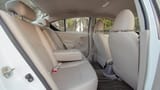 Used 2023 Nissan Sunny SV in White – Rear Passenger Side Cabin View for Sale at First Choice Cars Dubai Sharjah