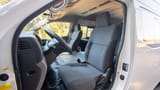 Used 2021 Nissan Urvan High Roof in White – Front Driver Side Cabin View for Sale at First Choice Cars Dubai Sharjah