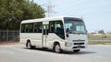 Used 2022 Toyota Coaster High Roof in White – Right Front Diagonal (45°) View for Sale at First Choice Cars Dubai Sharjah