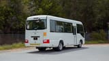 Used 2022 Toyota Coaster High Roof in White – Right Back Diagonal (45°) View for Sale at First Choice Cars Dubai Sharjah