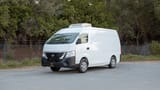 Used 2023 Nissan Urvan High Roof in White – Left Front Diagonal (45°) View for Sale at First Choice Cars Dubai Sharjah