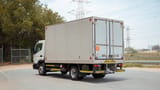 Used 2020 Mitsubishi Canter Chiller Box in White – Left Back Diagonal (45°) View for Sale at First Choice Cars Dubai Sharjah