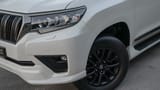 Used 2022 Toyota Prado VXR in White – Headlight Close-up for Sale at First Choice Cars Dubai Sharjah