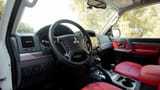 Used 2022 Mitsubishi Pajero GLS in White – Driver Side Dashboard & Steering View for Sale at First Choice Cars Dubai Sharjah
