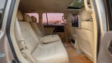 Used 2017 Toyota Land Cruiser GXR in Beige – Rear Passenger Side Cabin View for Sale at First Choice Cars Dubai Sharjah