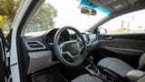 Used 2023 Hyundai Accent Smart in White – Driver Side Dashboard & Steering View for Sale at First Choice Cars Dubai Sharjah