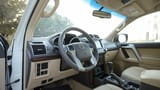 Used 2016 Toyota Prado VXR in White – Driver Side Dashboard & Steering View for Sale at First Choice Cars Dubai Sharjah