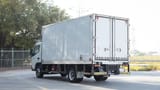 Used 2022 Mitsubishi Canter Chiller Box in White – Left Back Diagonal (45°) View for Sale at First Choice Cars Dubai Sharjah
