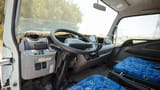 Used 2024 Mitsubishi Canter Cargo Body in White – Driver Side Dashboard & Steering View for Sale at First Choice Cars Dubai Sharjah