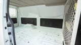 Used 2023 Nissan Urvan Standard Roof in White – Delivery Box Right Side Interior View for Sale at First Choice Cars Dubai Sharjah