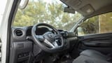 Used 2023 Nissan Urvan Standard Roof in White – Driver Side Dashboard & Steering View for Sale at First Choice Cars Dubai Sharjah
