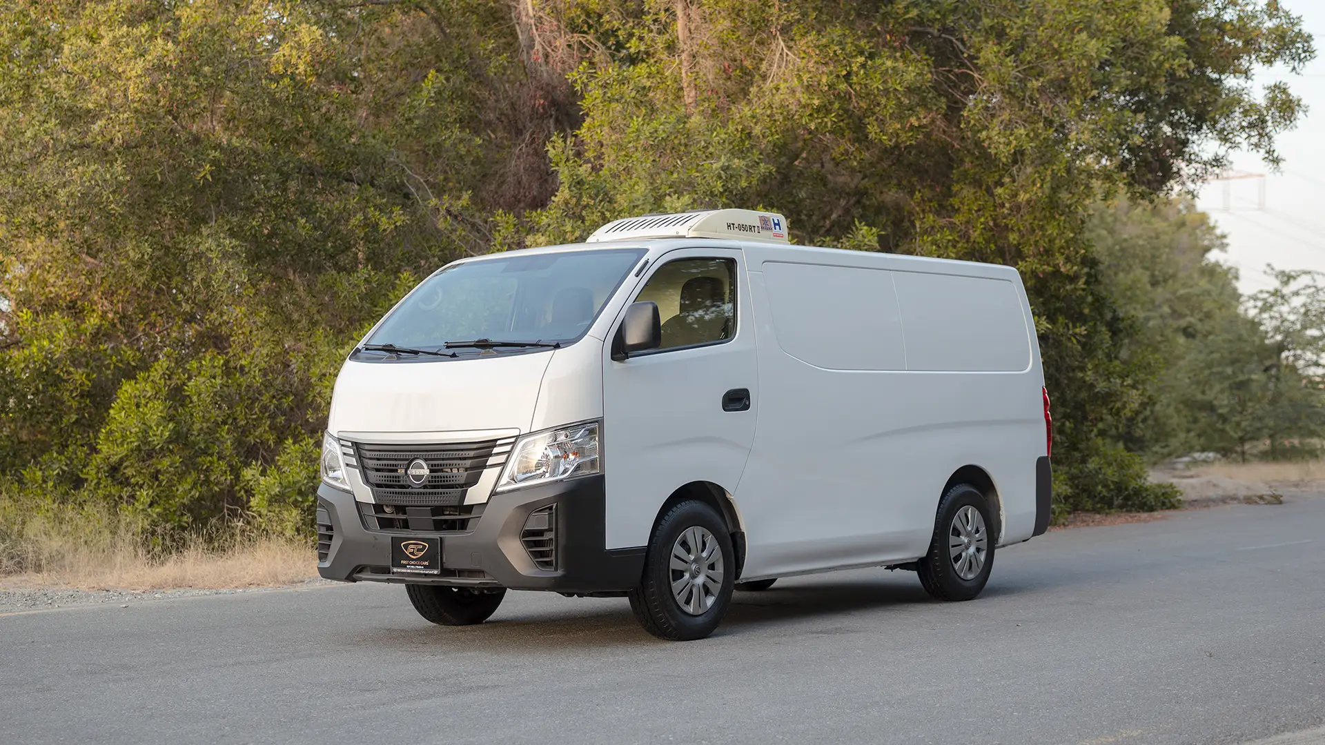 Used 2023 Nissan Urvan Standard Roof in White – Left Front Diagonal (45°) View for Sale at First Choice Cars Dubai Sharjah