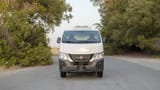 Used 2023 Nissan Urvan Standard Roof in White – Front View for Sale at First Choice Cars Dubai Sharjah