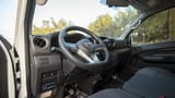 Used 2023 Nissan Urvan Standard Roof in White – Driver Side Dashboard & Steering View for Sale at First Choice Cars Dubai Sharjah