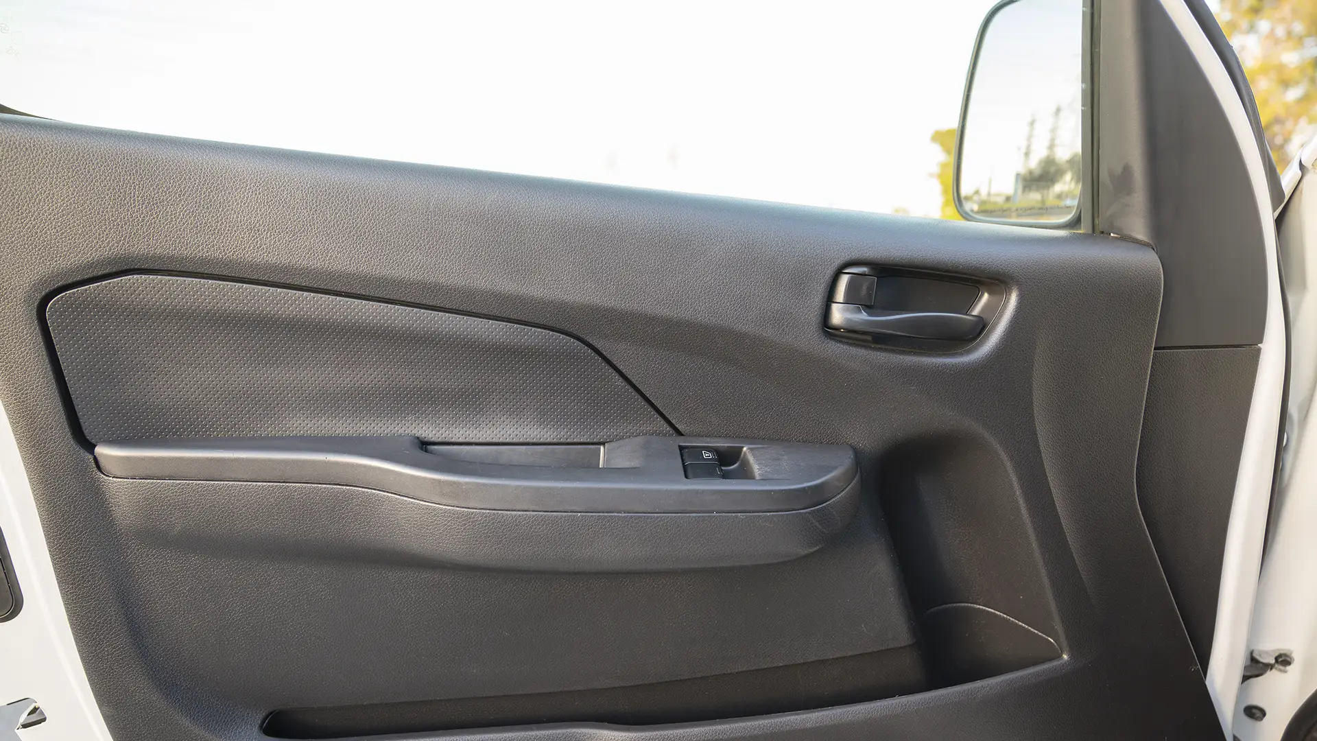 Used 2023 Nissan Urvan Standard Roof in White – Driver Door Panel Full View for Sale at First Choice Cars Dubai Sharjah